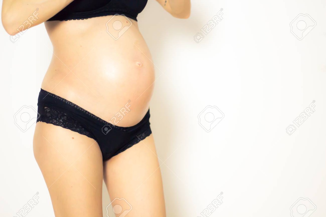 93937380-pregnant-belly-and-black-underwear-on-white-background.jpg