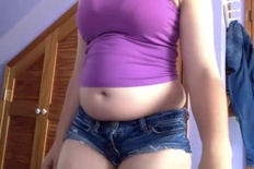 Chubby girl in tiny shorts jiggles all over