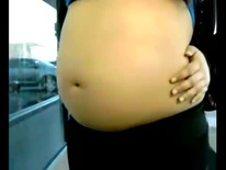 Skittles in her pregnant navel
