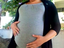 Lightly stretch marked baby bump