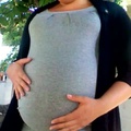Lightly stretch marked baby bump