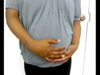 Rubbing her beautiful black egg shaped pregnant belly (Low)
