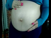 Pregnant woman humming to her child (Low)