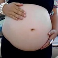 Ring, pearls, and pregnant belly (Low)
