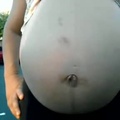 Pregnant woman with kid in the background (Low)