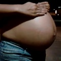 Short_clip_of_a_8_month_pregnant_belly.mp4