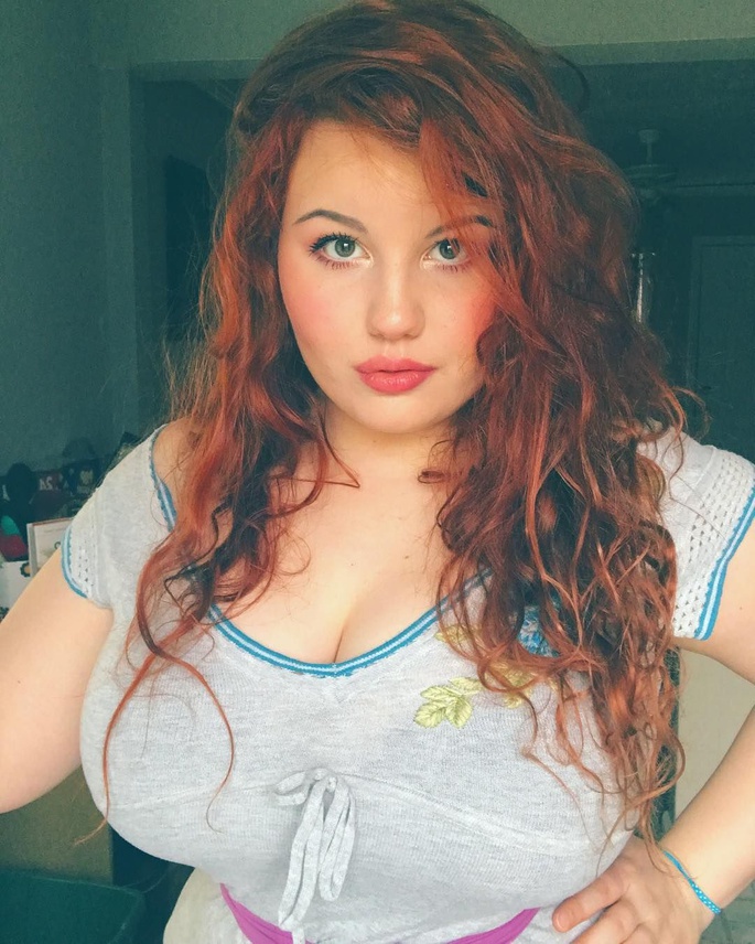 Curvy redhead shared long hair