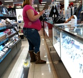 Obese Girl With Stomach Hanging At Store