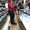 Obese Girl With Stomach Hanging At Store.jpg