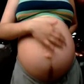 daughter rubs pregnant belly full of aliens