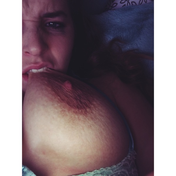 randalin biting one of her breasts.jpg