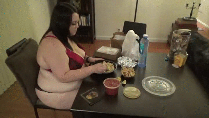 Two fat women belly bumping.