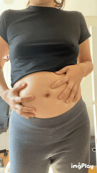her round belly bounces with pudgy fat as she continues to outgrow all her clothes.gif